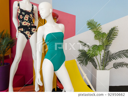 Mannequins in colorful swimsuits in clothes shop. Summer vacation. Fashion model. Colorful vacation concept 92950662