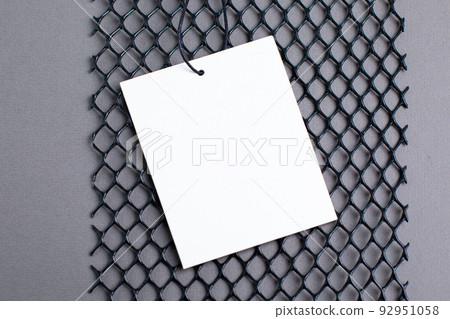 Blank tag tied with string. Price tag, gift tag, sale tag, address label on gray background modern Technology design  92951058