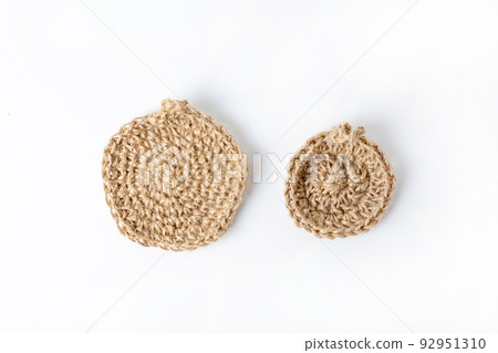 Natural washcloth made of craft thread for washing dishes. The concept of waste-free production , zero waste on white background isolated  92951310