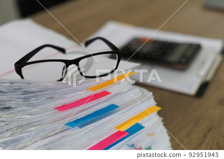Stack of business paper Businessman working reading documents graph financial to job succes Analyze document plans documents on office desk 92951943
