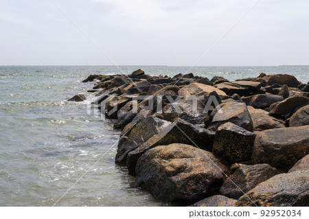 Large rock jetty extending out into Narragansett Bay 92952034
