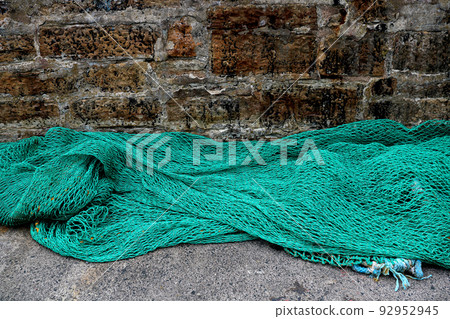 Old Harbour Wall with Fishing Nets Drying in the Open Air Old Harbour Wall with Fishing Nets Drying in the Open Air 92952945