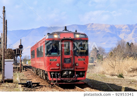 Trans-Kyushu Limited Express departing from Aso Station with Mt. Aso in the background Trans-Kyushu Limited Express departing from Aso Station with Mt. Aso in the background 92953341