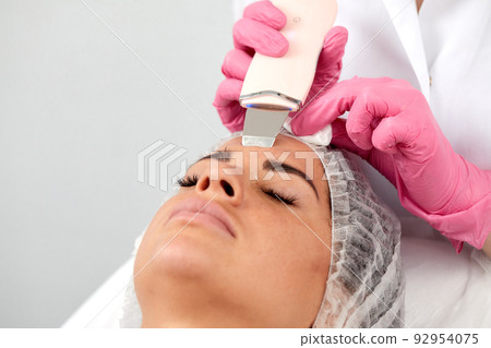 Skin Care. Close-up Of Beautiful Woman Receiving Ultrasound Cavitation Facial Peeling. Ultrasonic Skin Cleansing Procedure. Beauty Treatment. Cosmetology. Beauty Spa Salon. 92954075
