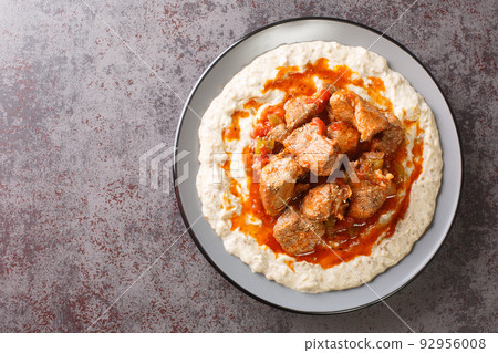 Turkish Food Hunkar Begendi made with Eggplant and Meat closeup in the plate. Horizontal top view 92956008
