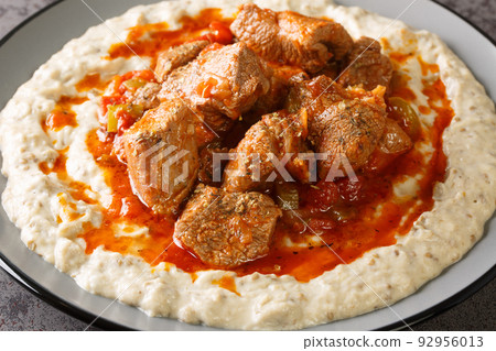 Turkish Food Hunkar Begendi made with Eggplant and Meat closeup in the plate. Horizontal Turkish Food Hunkar Begendi made with Eggplant and Meat closeup in the plate. Horizontal 92956013