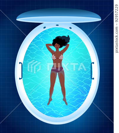 Young woman resting in floating tank capsule 92957229