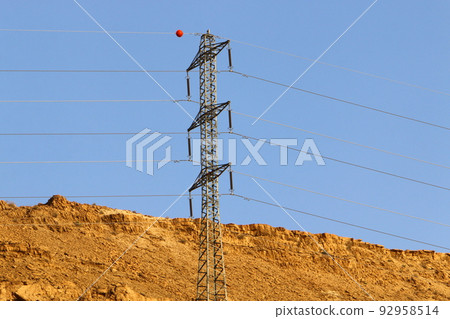 Electrical wires carrying high voltage current. 92958514