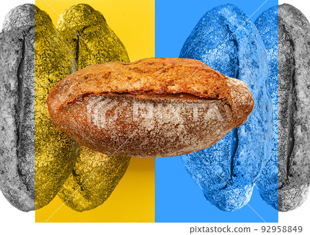 Artisan bread on blue and yellow background. Loaves on wheat bread on abstrackt Ukrainian background. Russia blockade Ukrainian grain Artisan bread on blue and yellow background. Loaves on wheat bread on abstrackt Ukrainian background. Russia blockade Ukrainian grain 92958849