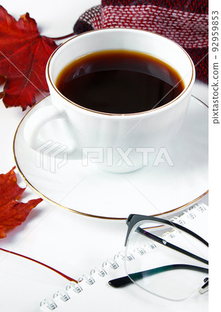 Warm checkered plaid and cup of hot espresso coffee on white background. Hello autumn concept. Fallen red leaves and drink for cold weather. Warm checkered plaid and cup of hot espresso coffee on white background. Hello autumn concept. Fallen red leaves and drink for cold weather. 92959853