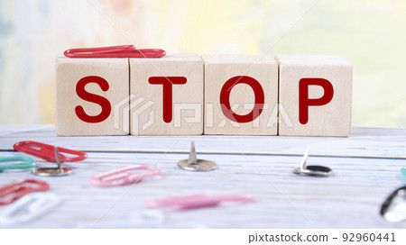 Four wooden cubes with letters stop. Business marketing concept 92960441