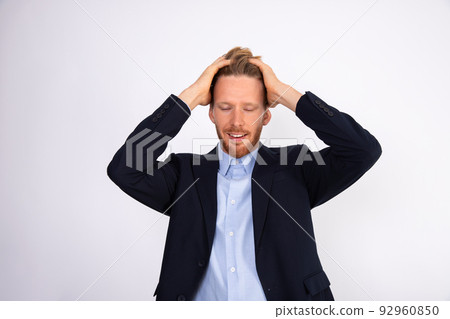 Portrait of smiling businessman forgetting something 92960850