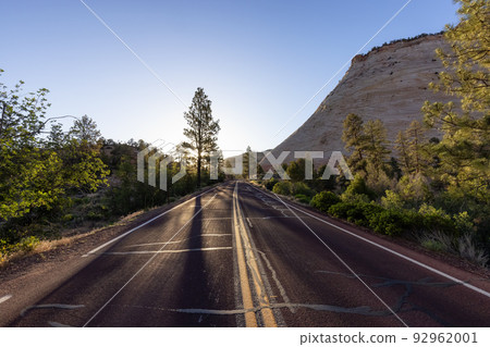 Scenic Road in American Mountain Landscape. Sunny Morning Sunrise Sky Scenic Road in American Mountain Landscape. Sunny Morning Sunrise Sky 92962001