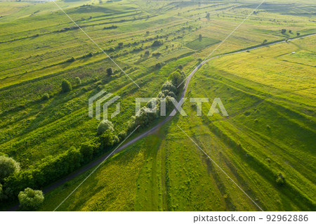 Aerial view of countryside vibrant green hills. Transylvania, Romania 92962886