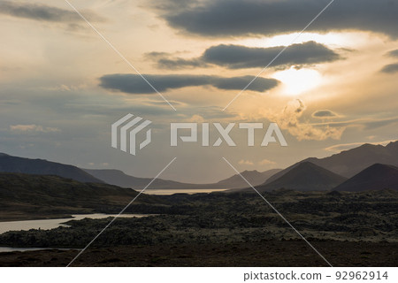 Volcanic landscape with river in Iceland in sunset Volcanic landscape with river in Iceland in sunset 92962914