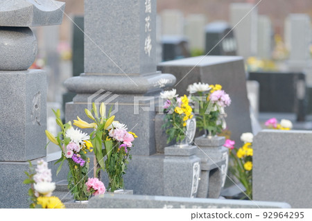 Tombstone on the grave Buddha flower 92964295