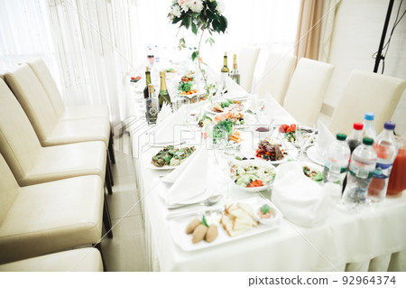 Interior of a restaurant prepared for wedding ceremony Interior of a restaurant prepared for wedding ceremony 92964374