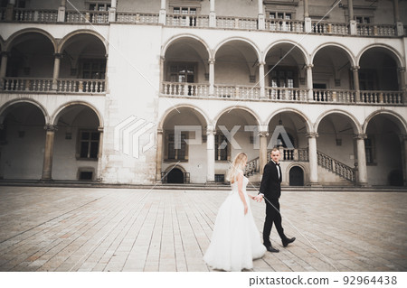 Wedding couple bride and groom holding hands Wedding couple bride and groom holding hands 92964438