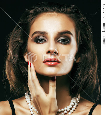 beauty rich woman with bright makeup wearing luxury jewellery on black background, fashion lady close up 92964685