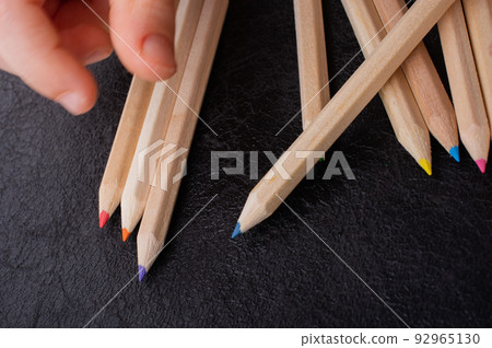 Hand holding colored pencils for creative idea and concept. 92965130