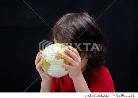 Happy preschooler boy discovering world as back to school concept 92965131