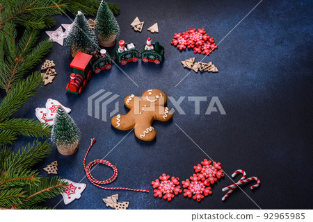 Christmas homemade gingerbread cookies on a dark concrete table table Christmas homemade gingerbread cookies on a dark concrete table table 92965985
