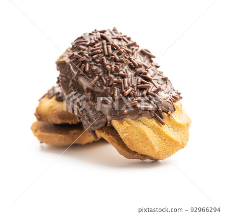 Petit fours with chocolate sprinkles. Mini chocolate dessert. Petit fours with chocolate sprinkles. Mini chocolate dessert. 92966294