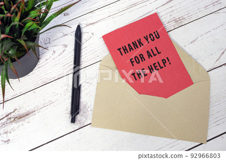 Thank you for all the help text on red card with envelope and pen on wooden desk 92966803