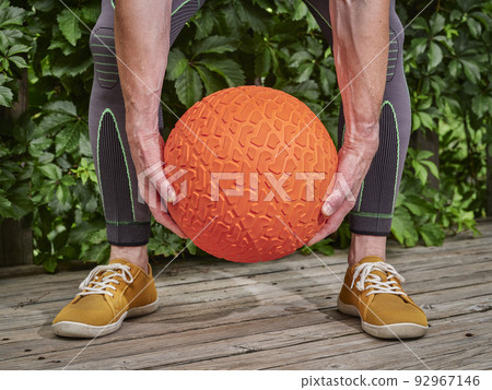 fitness workout with a heavy slam ball fitness workout with a heavy slam ball 92967146