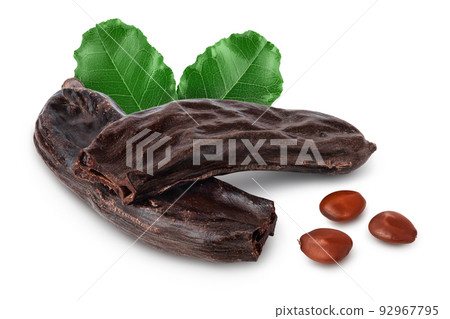 Ripe carob pods and bean isolated on white background with full depth of field 92967795
