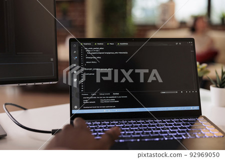Male programmer using coding encryption interface app on laptop screen, working with binary code and cloud server. Coder programming security firewall on terminal window. Close up. Male programmer using coding encryption interface app on laptop screen, working with binary code and cloud server. Coder programming security firewall on terminal window. Close up. 92969050