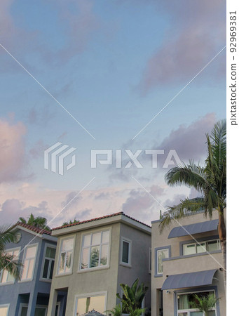 Vertical Puffy clouds at sunset Two-storey residential buildings with modern mediterranean desig Vertical Puffy clouds at sunset Two-storey residential buildings with modern mediterranean desig 92969381