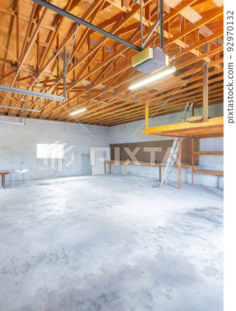 Vertical Large garage interior with automatic door operator machine Vertical Large garage interior with automatic door operator machine 92970132