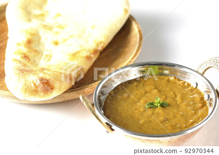 Keema curry and naan using mutton are photographed against a white background 92970344