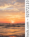 The coastline that becomes a sun candle and sinks 92972110