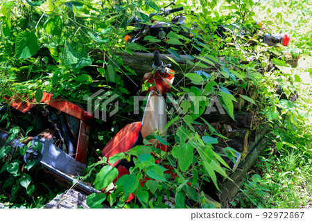 Abandoned and forgotten motorcycles in the mountains 92972867