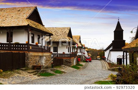 View of Holloko with wooden church View of Holloko with wooden church 92973320