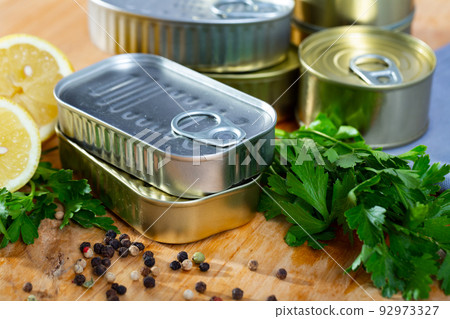 Golden and silver tin cans 92973327