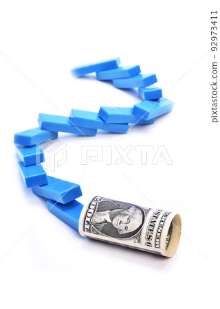 Domino and American dollar on white background. Domino and American dollar on white background. 92973411