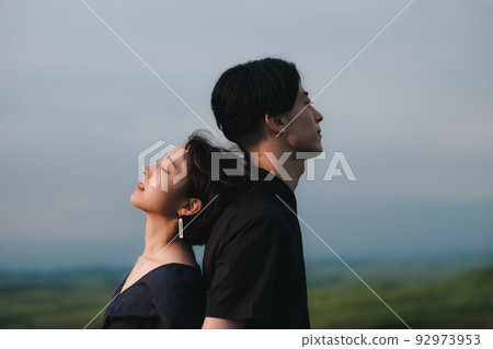 man and woman back to back in nature man and woman back to back in nature 92973953