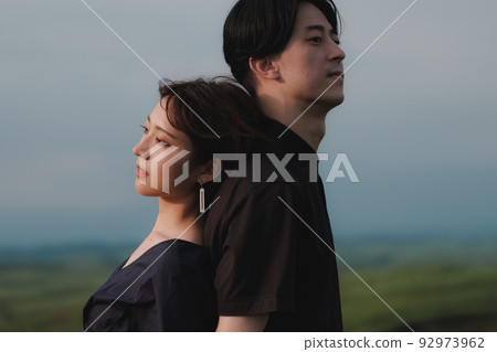 man and woman back to back in nature man and woman back to back in nature 92973962