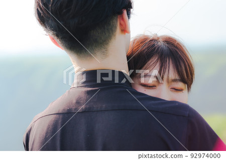 Men and women hugging Men and women hugging 92974000