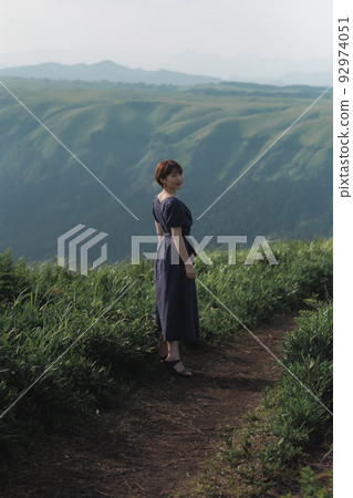woman standing in nature 92974051
