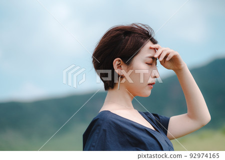 A woman who feels the wind in nature A woman who feels the wind in nature 92974165