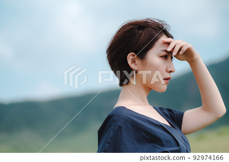 A woman who feels the wind in nature A woman who feels the wind in nature 92974166