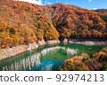A town submerged in a dam lake viewed from Tenguiwa Bridge in autumn 92974213