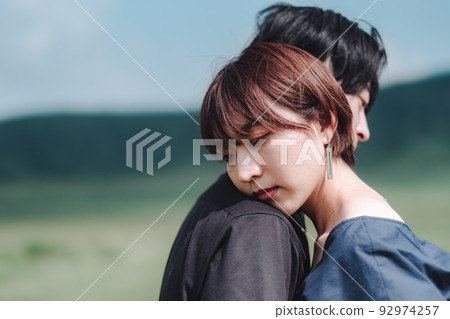 Men and women hugging Men and women hugging 92974257