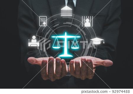 Justice and law concept, Man hand holding VR screen law icon background. Justice and law concept, Man hand holding VR screen law icon background. 92974488