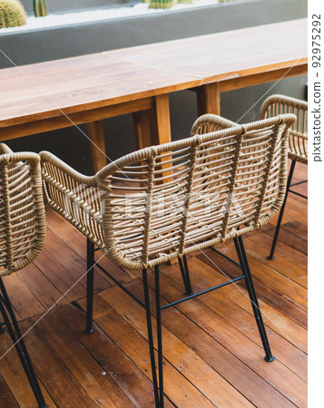Table and chairs in the garden cafe. 92975292
