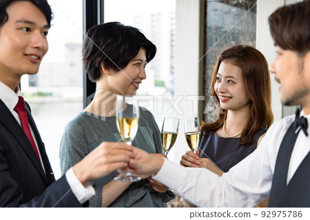 waiter handing champagne 92975786